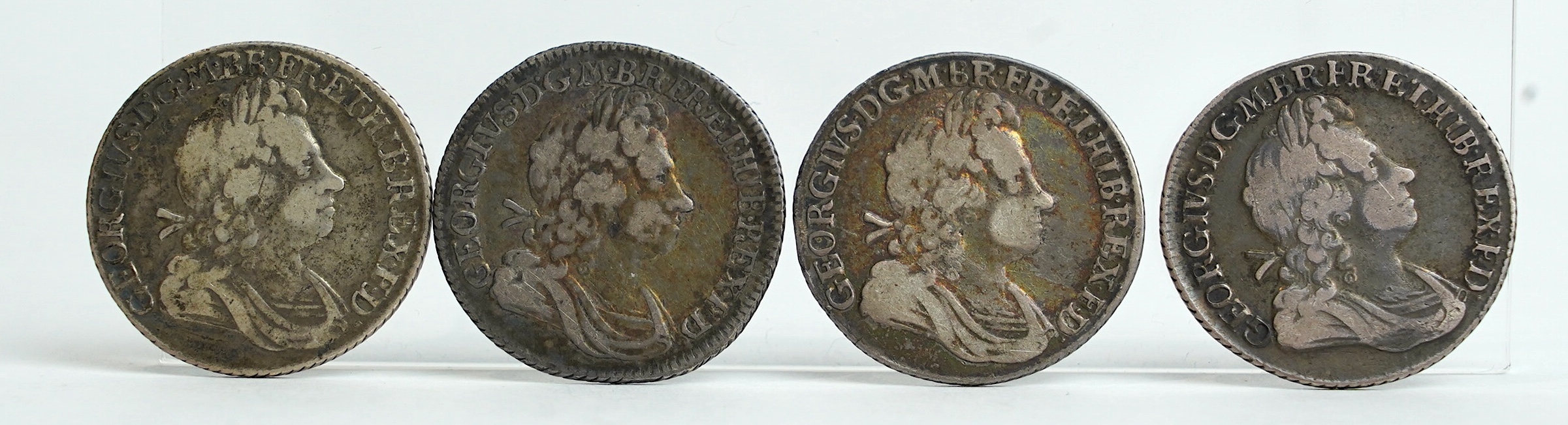 British silver coins, George I, four shilling coins, 1720, good fine, 1721/0, good fine, two 1723, SSC in angles, both fine/good fine, a sixpence 1723, SSC in angles, about VF, and a fourpence 1723, creased otherwise goo